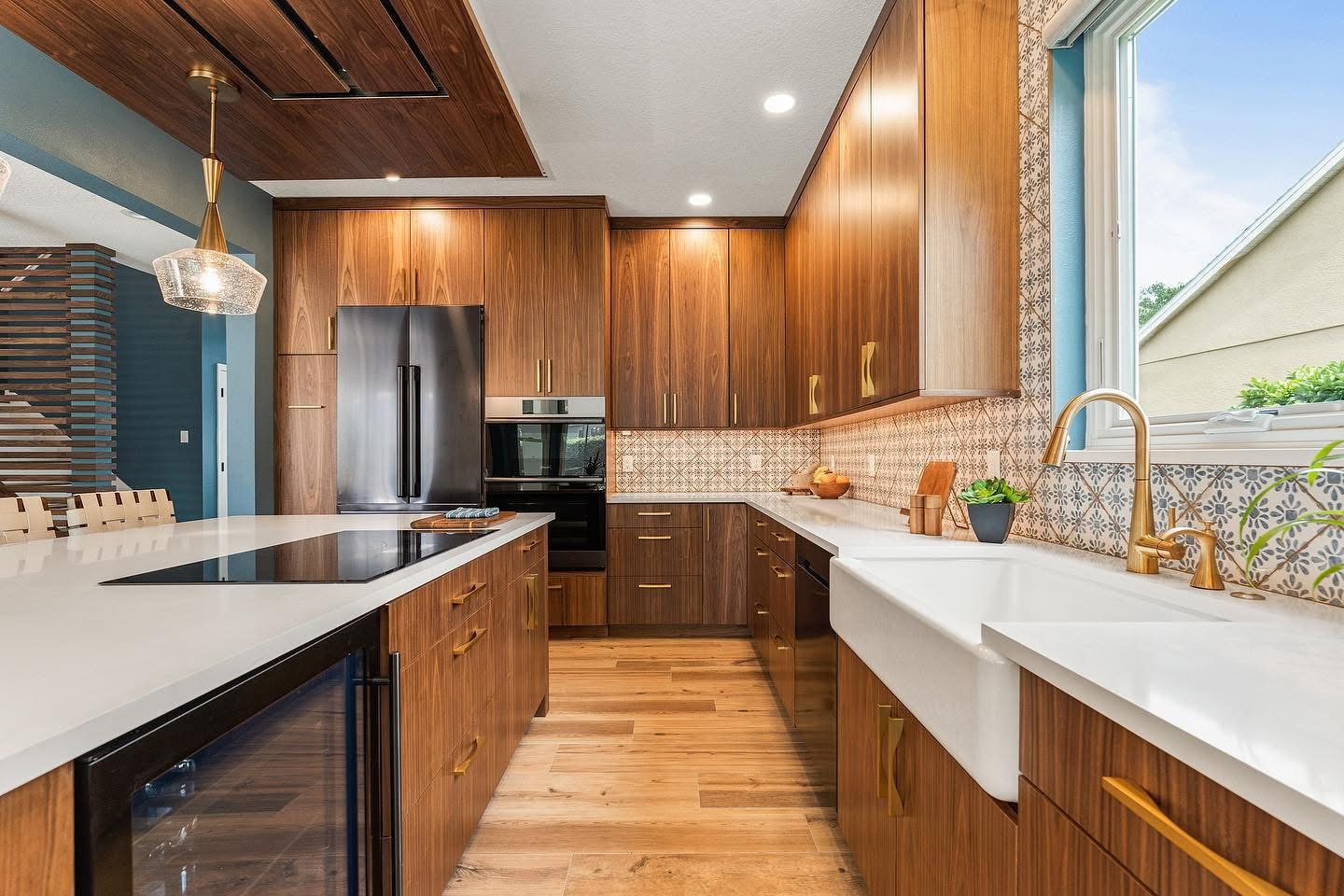 Kitchen remodel featuring patterned tile backsplash and farmhouse sink